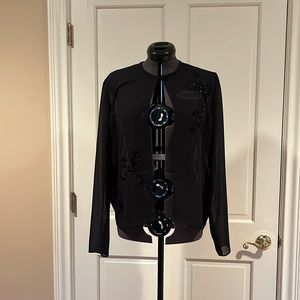 Woman’s covering for evening. Black with some beading.